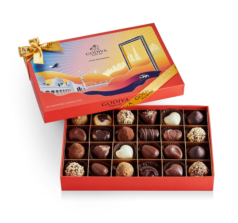 A festive red and white Godiva chocolate box showcasing an elegant assortment of premium chocolates for the holiday season.